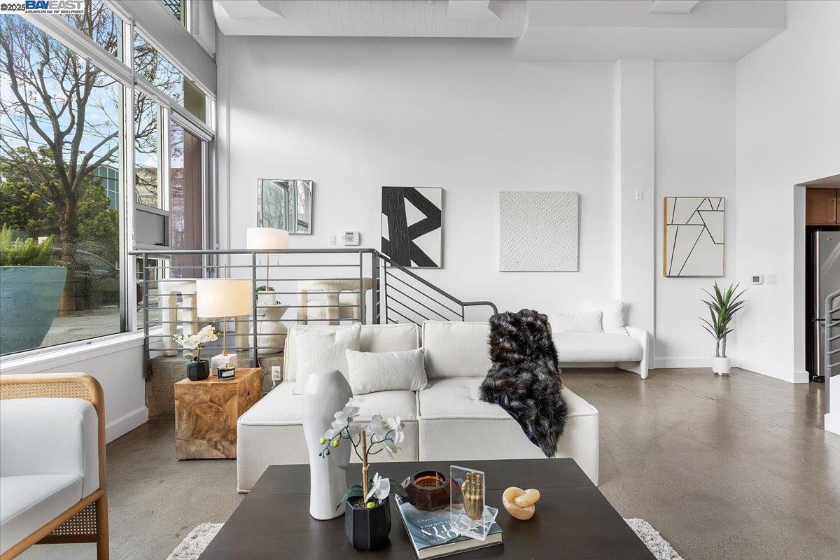 226 2nd Street Oakland, CA 94607 - Photo 25 of 28 a living room with furniture and wooden floor