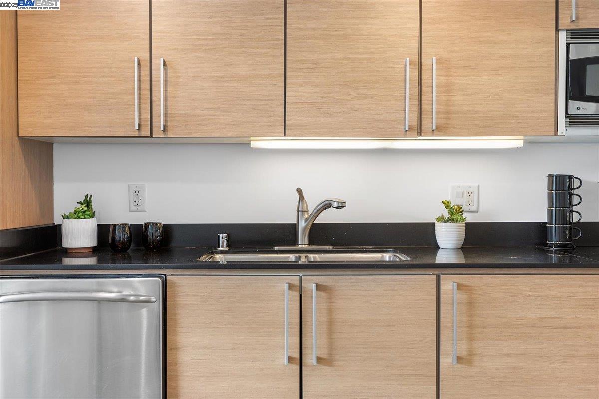 226 2nd Street Oakland, CA 94607 - Photo 10 of 28 a kitchen with granite countertop a sink and a granite counter tops