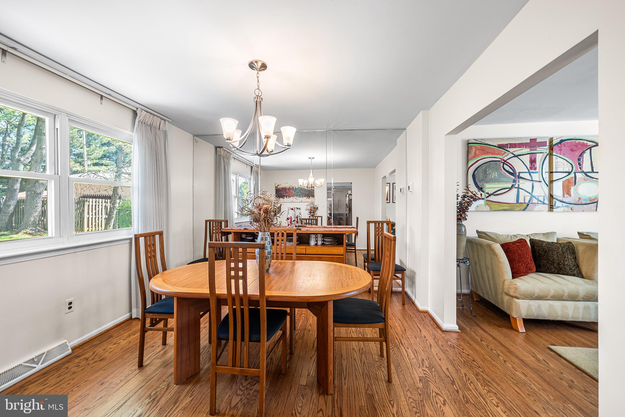 702 Brookhaven Road Wallingford, PA 19086 - Photo 17 of 31 a view of a dining room with furniture and wooden floor