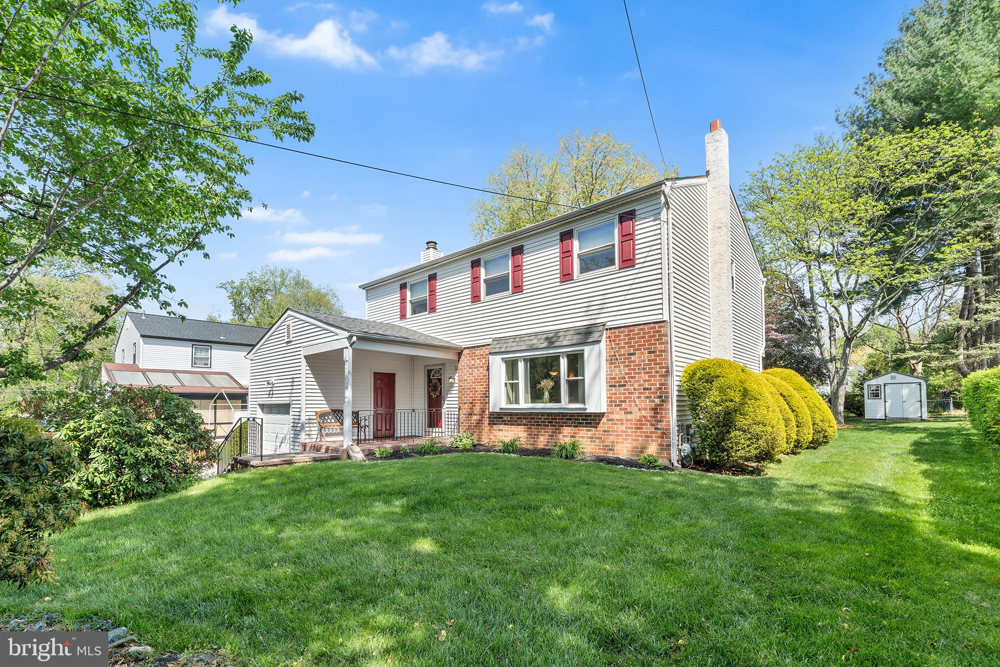 702 Brookhaven Road Wallingford, PA 19086 - Photo 2 of 31 a front view of house with yard and outdoor seating