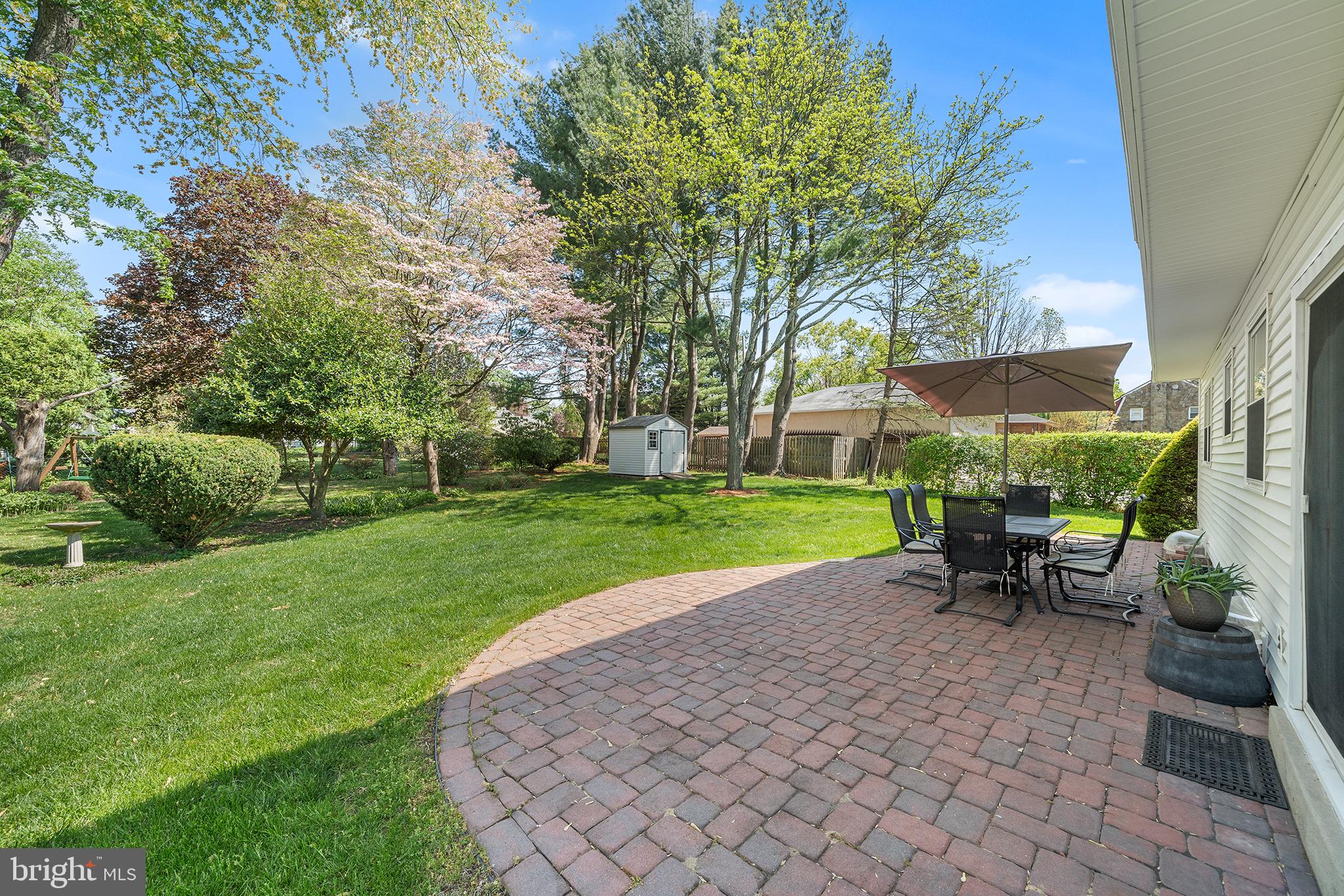 702 Brookhaven Road Wallingford, PA 19086 - Photo 31 of 31 a view of a house with backyard sitting area and garden