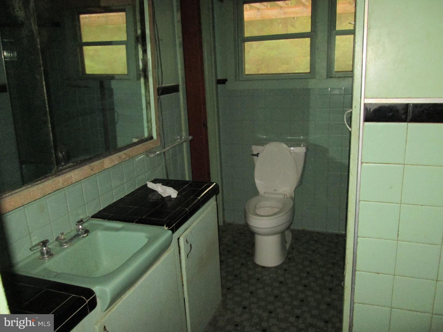 7627 Old Receiver Road Frederick, MD 21702 - Photo 8 of 15 a bathroom with a toilet sink and mirror