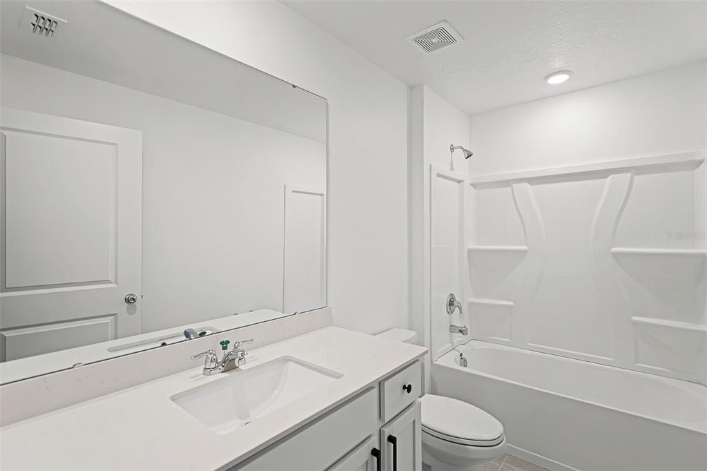 1993 Sarah Street Lake Wales, FL 33859 - Photo 15 of 31 a bathroom with a sink toilet tub and shower