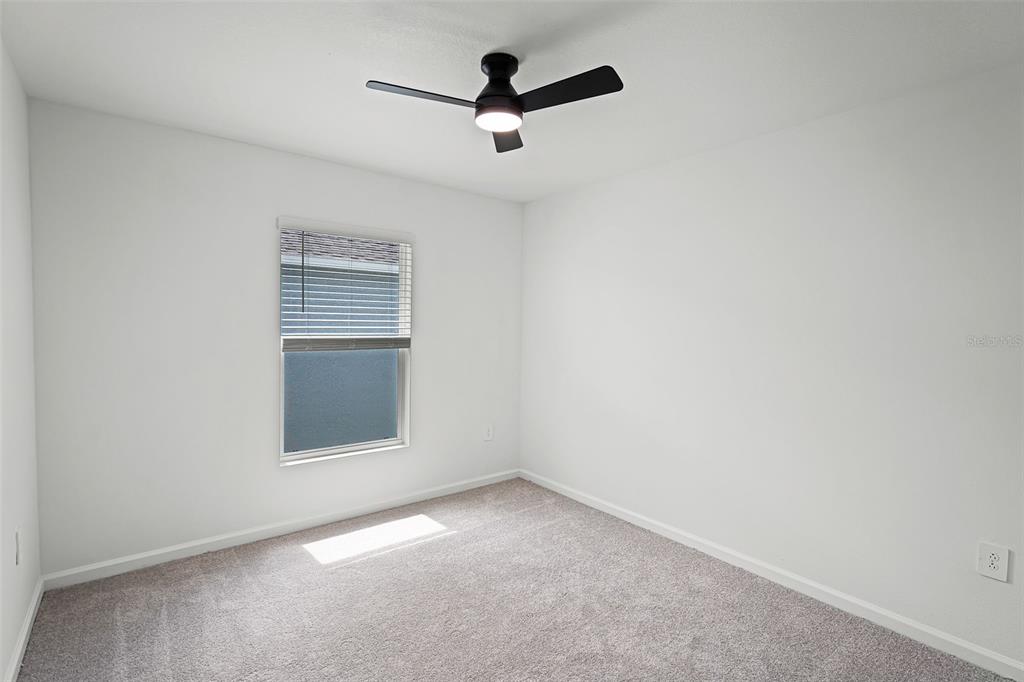 1993 Sarah Street Lake Wales, FL 33859 - Photo 16 of 31 an empty room with a ceiling fan and window