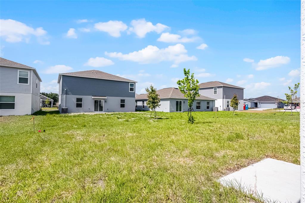 1993 Sarah Street Lake Wales, FL 33859 - Photo 20 of 31 a front view of house with yard