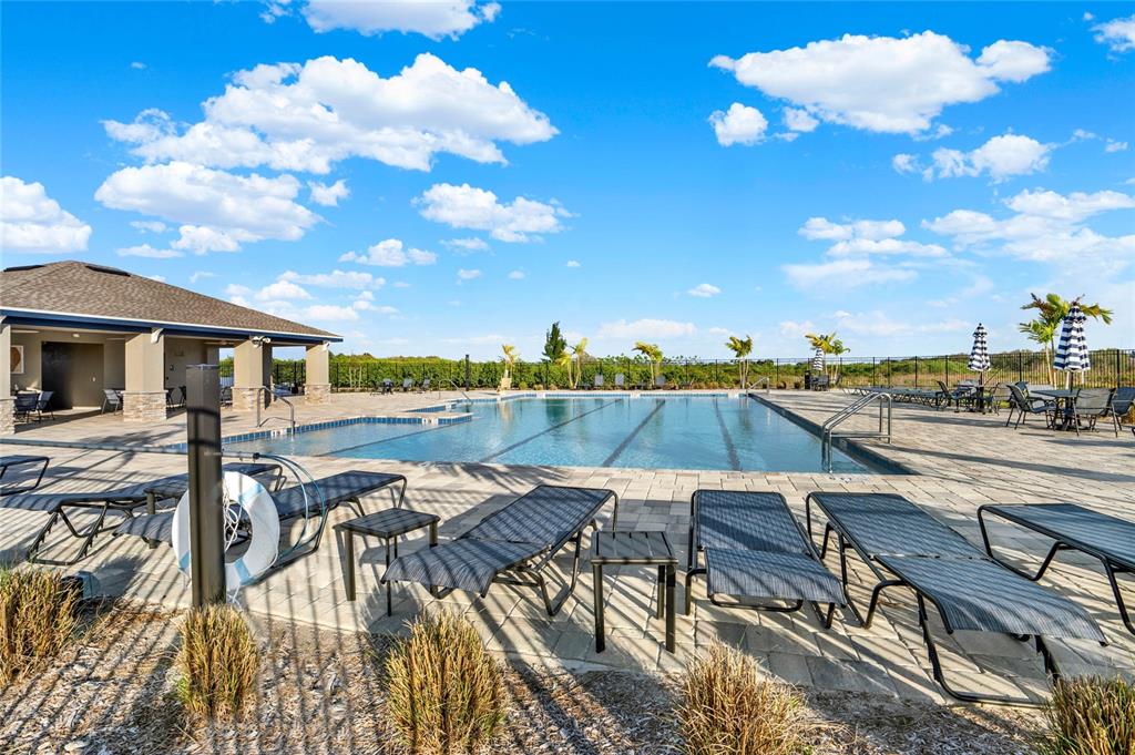 1993 Sarah Street Lake Wales, FL 33859 - Photo 22 of 31 a view of a swimming pool with lounge chairs