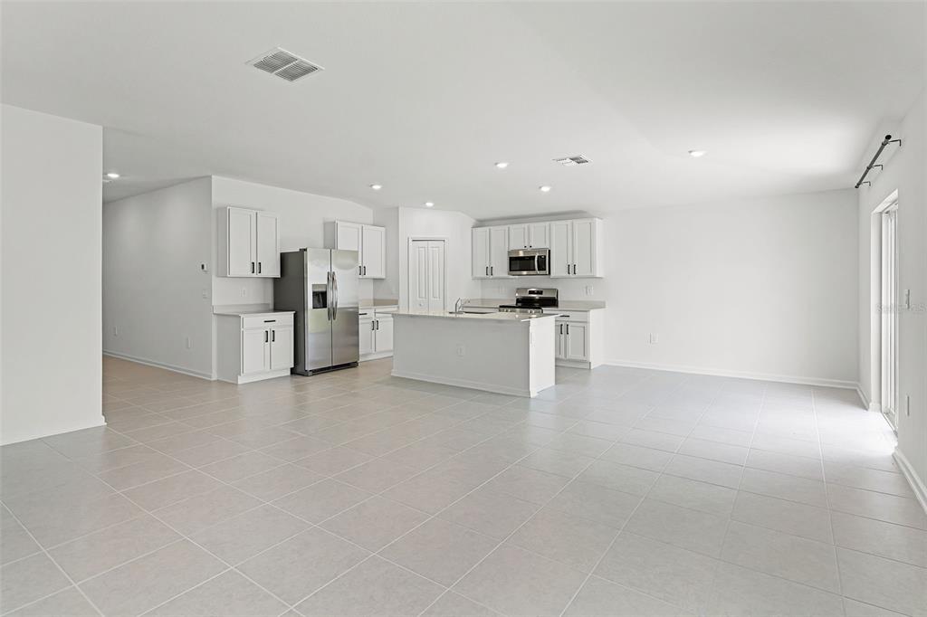 1993 Sarah Street Lake Wales, FL 33859 - Photo 9 of 31 a view of a kitchen with refrigerator and a sink
