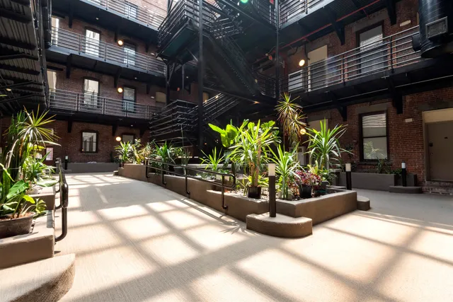 a view of a chairs and tables in a patio