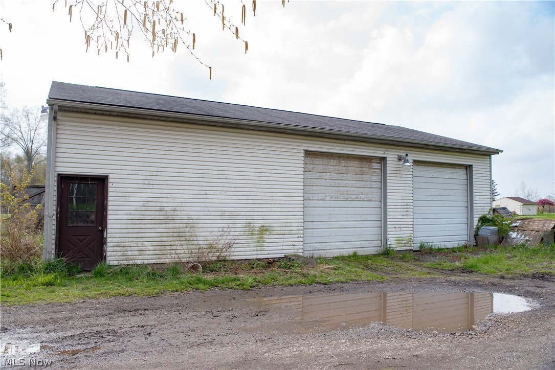 3810 Dawley Road Ravenna, OH 44266 - Photo 20 of 35 48' x 48' Outbuilding / Barn has 3 doors that are 12' tall, 2 off driveway & 1 on south end (left in this pic)