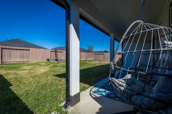 a view of backyard with patio