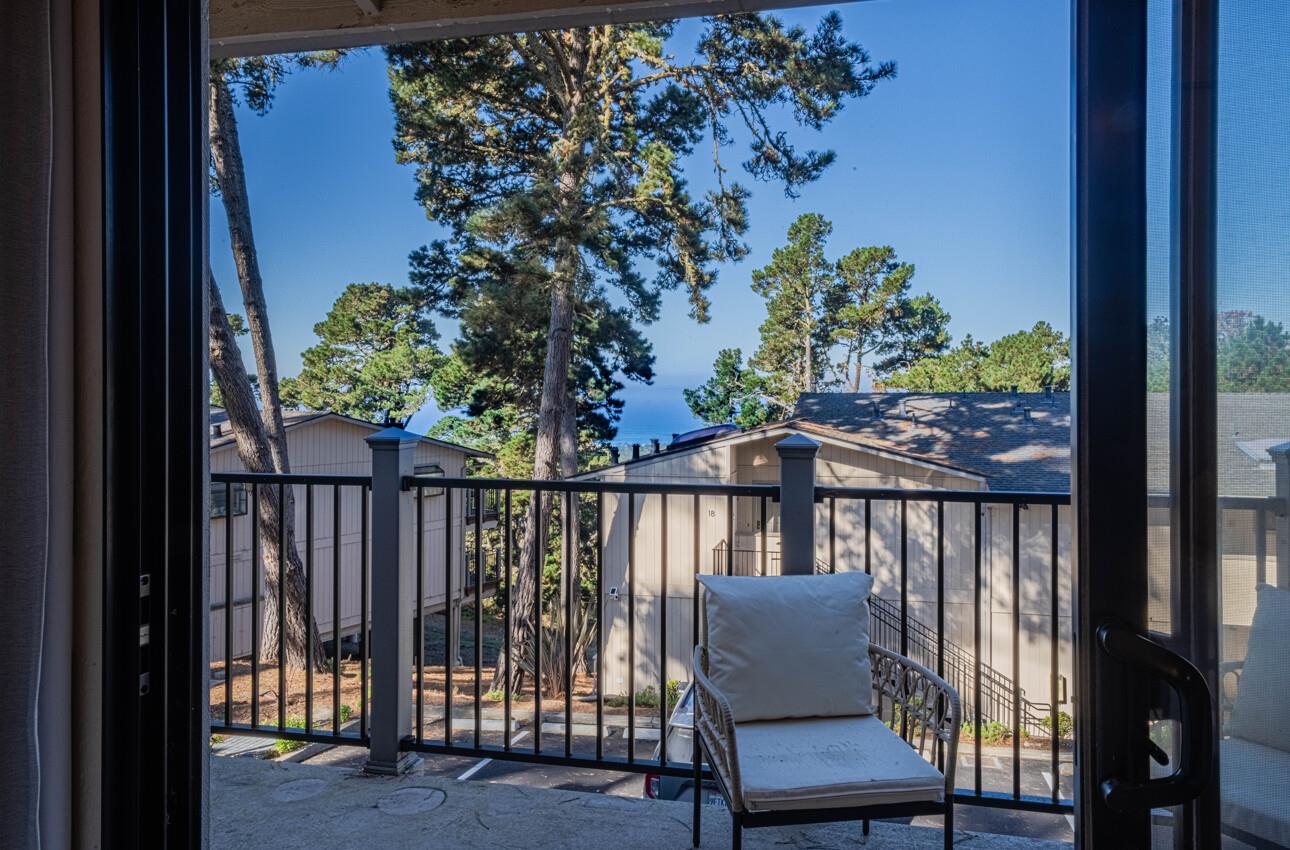 250 Forest Ridge Road, Unit 27 Monterey, CA 93940 - Photo 21 of 38 a view of a chair and table in the balcony