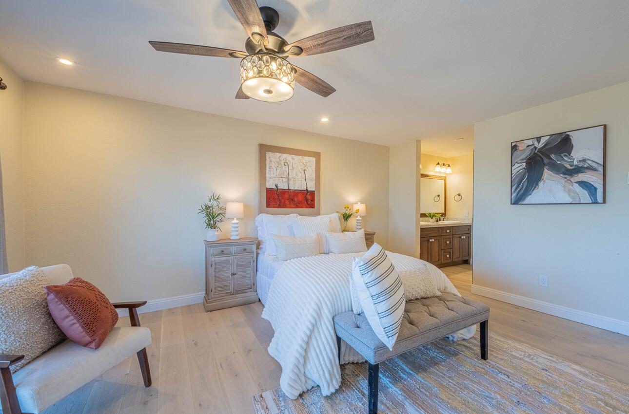 250 Forest Ridge Road, Unit 27 Monterey, CA 93940 - Photo 24 of 38 a bed room with a bed and a couch