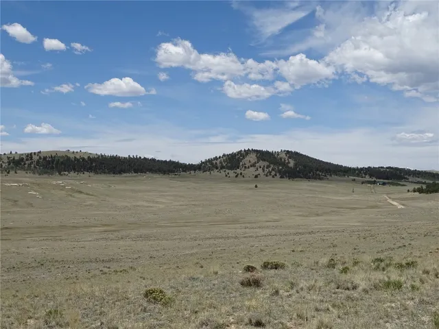 a view of a beach with a building in the background