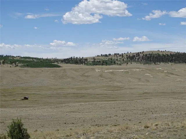 a view of a lake with houses in the back