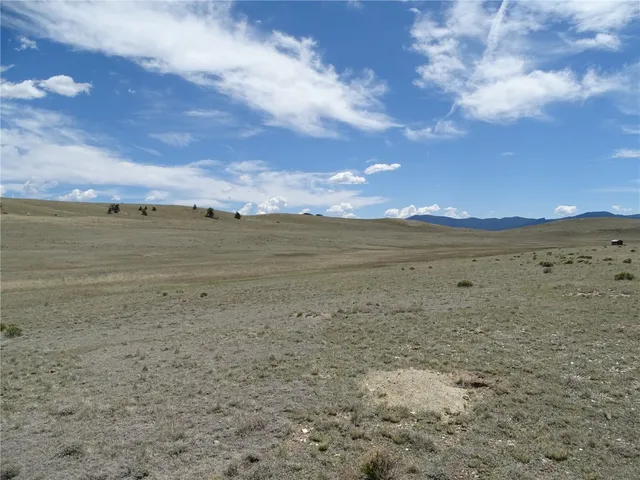 a view of an ocean beach and a mountain