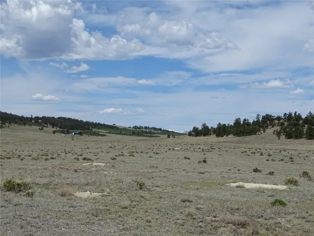 a view of an ocean beach and mountain