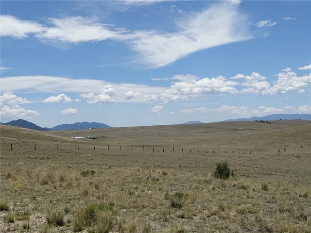 a view of an ocean beach and mountain