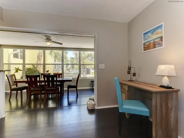 a view of a dining room with furniture window and wooden floor