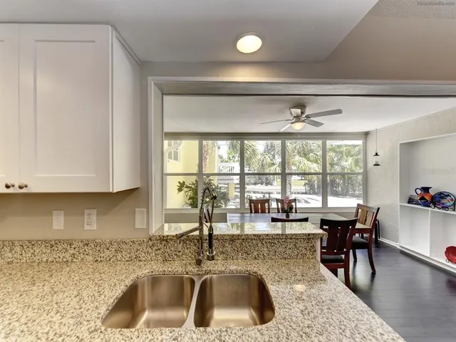a kitchen with a sink and a stove top oven