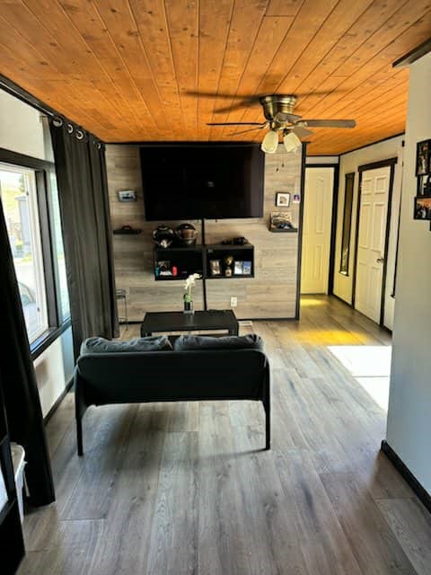 657 Lebec Road, Unit 27 Lebec, CA 93243 - Photo 2 of 6 a living room with a couch a rug and a flat screen tv