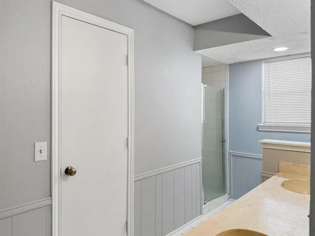 a view of a hallway with closet