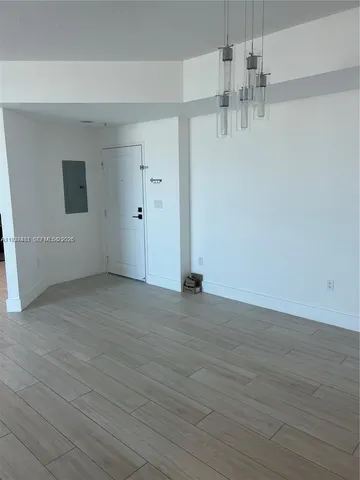 a view of a livingroom with wooden floor