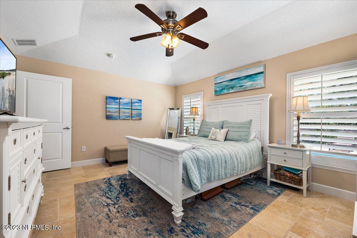 313 Eleventh Street St. Augustine, FL 32084 - Photo 17 of 35 a bedroom with a bed and a window