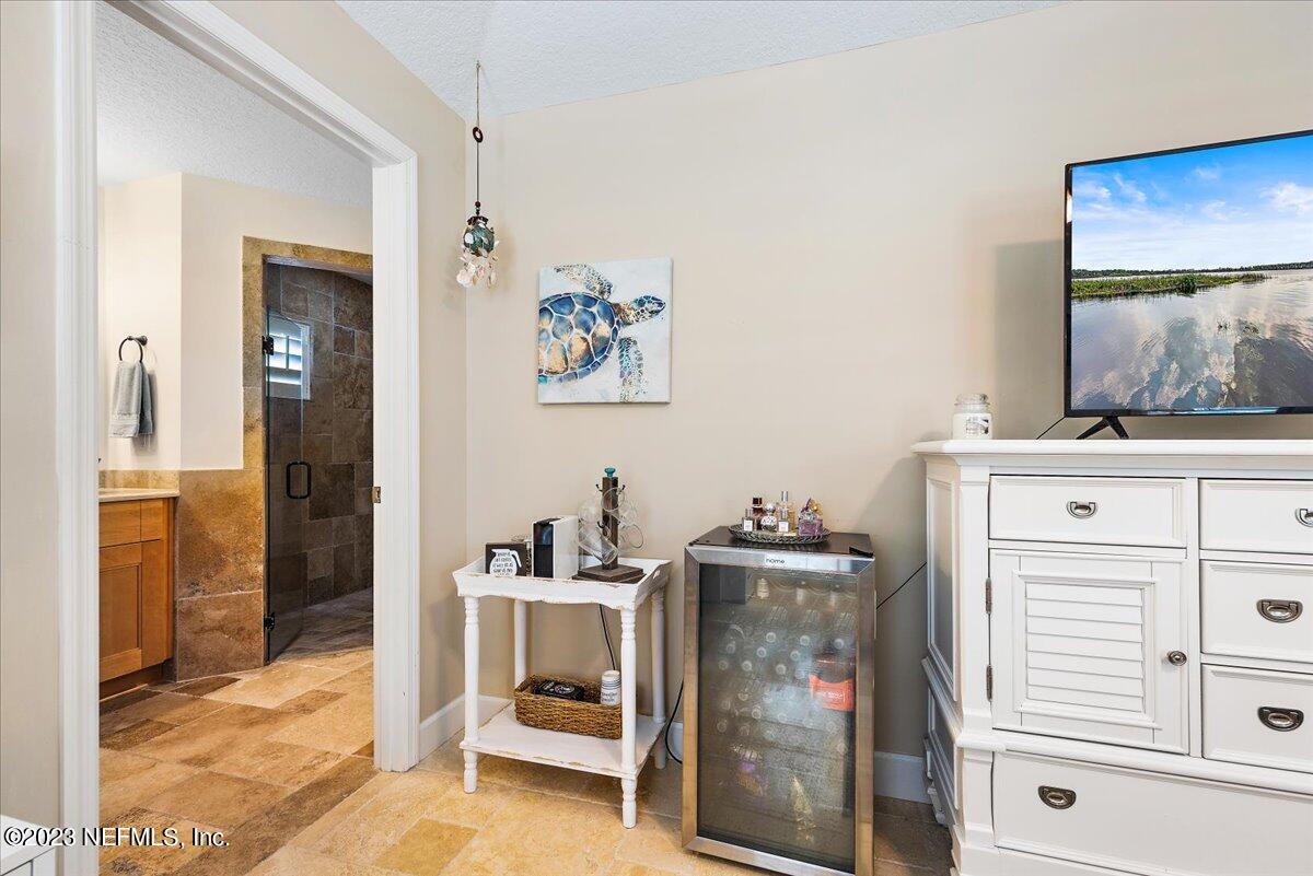 313 Eleventh Street St. Augustine, FL 32084 - Photo 18 of 35 a bedroom with a bed and a cabinets