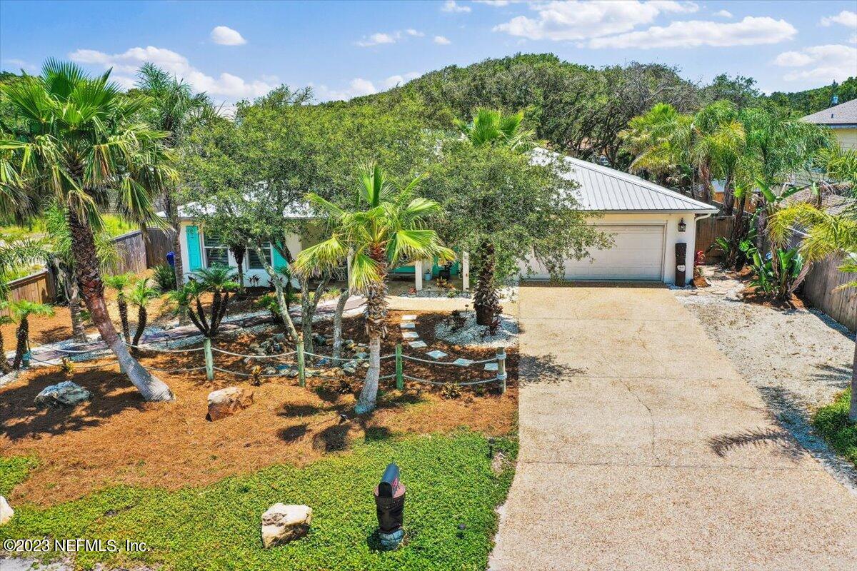 313 Eleventh Street St. Augustine, FL 32084 - Photo 2 of 35 a view of a backyard with plants and patio