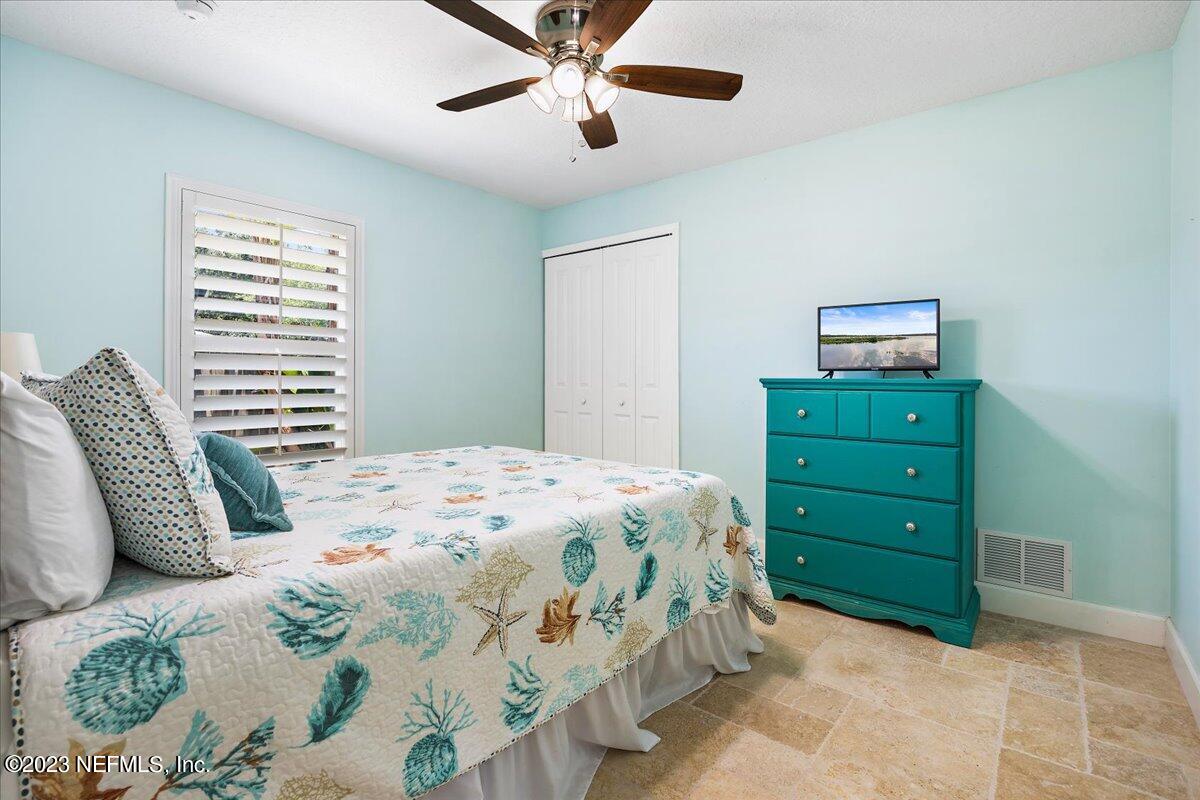 313 Eleventh Street St. Augustine, FL 32084 - Photo 26 of 35 a bedroom with a bed and a window