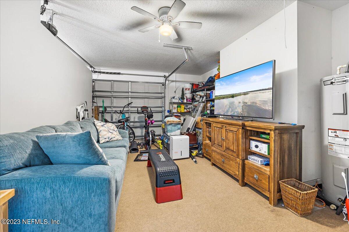 313 Eleventh Street St. Augustine, FL 32084 - Photo 28 of 35 a living room with furniture and flat screen tv