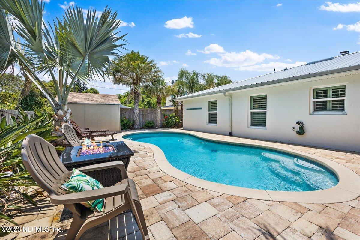 313 Eleventh Street St. Augustine, FL 32084 - Photo 32 of 35 a view of backyard with swimming pool outdoor seating