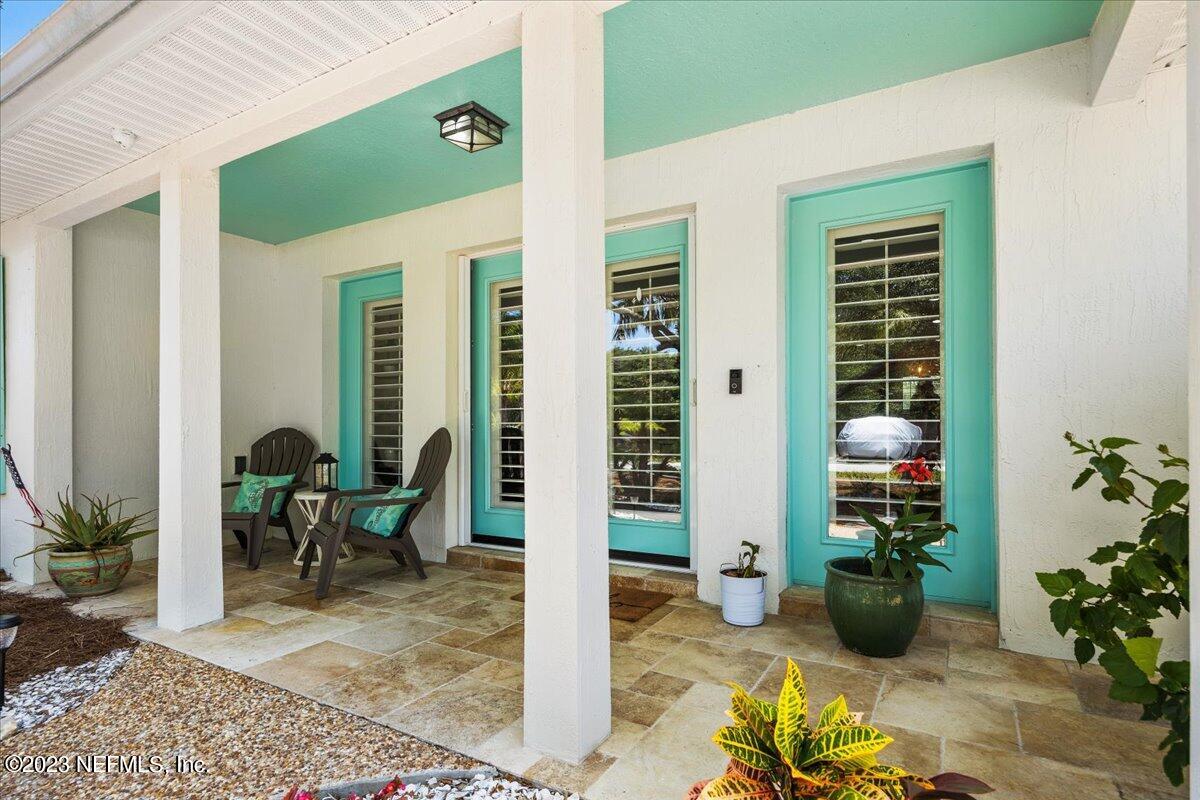 313 Eleventh Street St. Augustine, FL 32084 - Photo 7 of 35 a view of a two chairs in the patio
