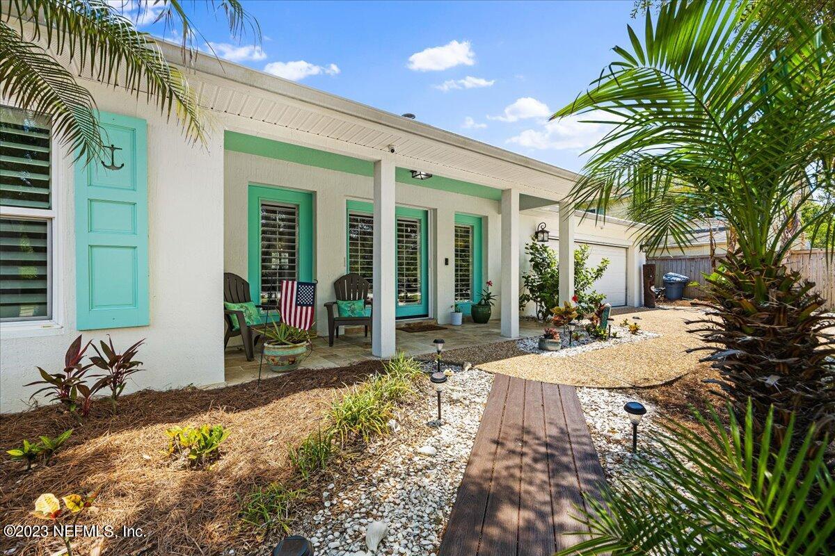 313 Eleventh Street St. Augustine, FL 32084 - Photo 8 of 35 a view of a dinning table and chairs in patio
