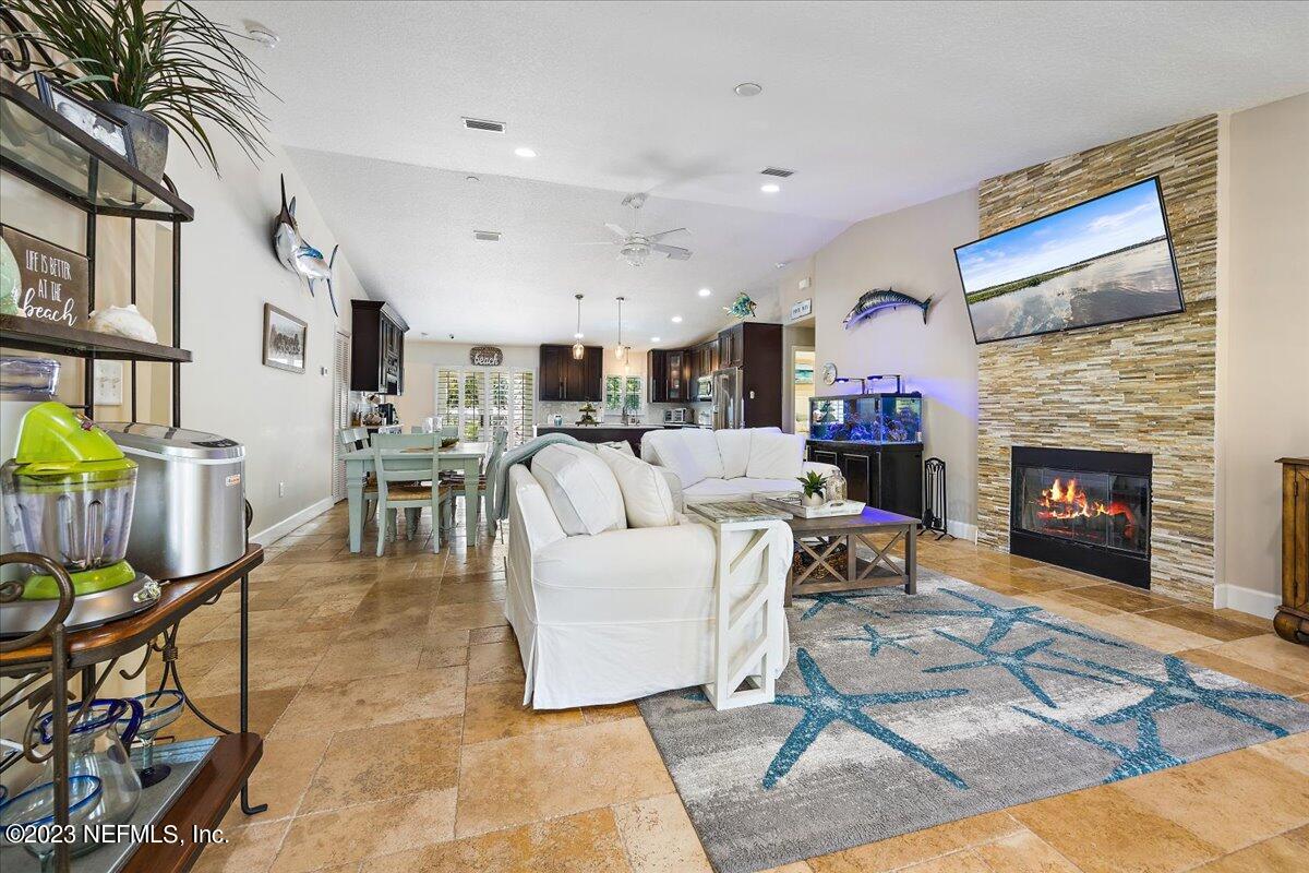 313 Eleventh Street St. Augustine, FL 32084 - Photo 9 of 35 a living room with furniture and a fireplace