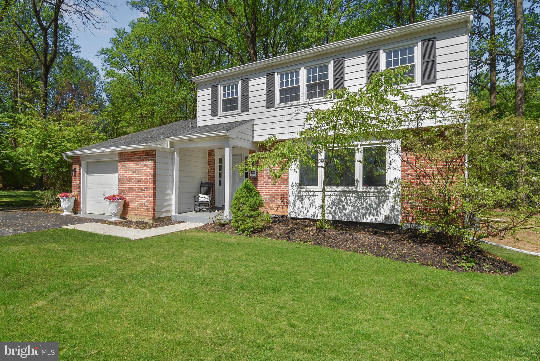 421 Concord Avenue Exton, PA 19341 - Photo 1 of 38 a front view of a house with a garden and yard