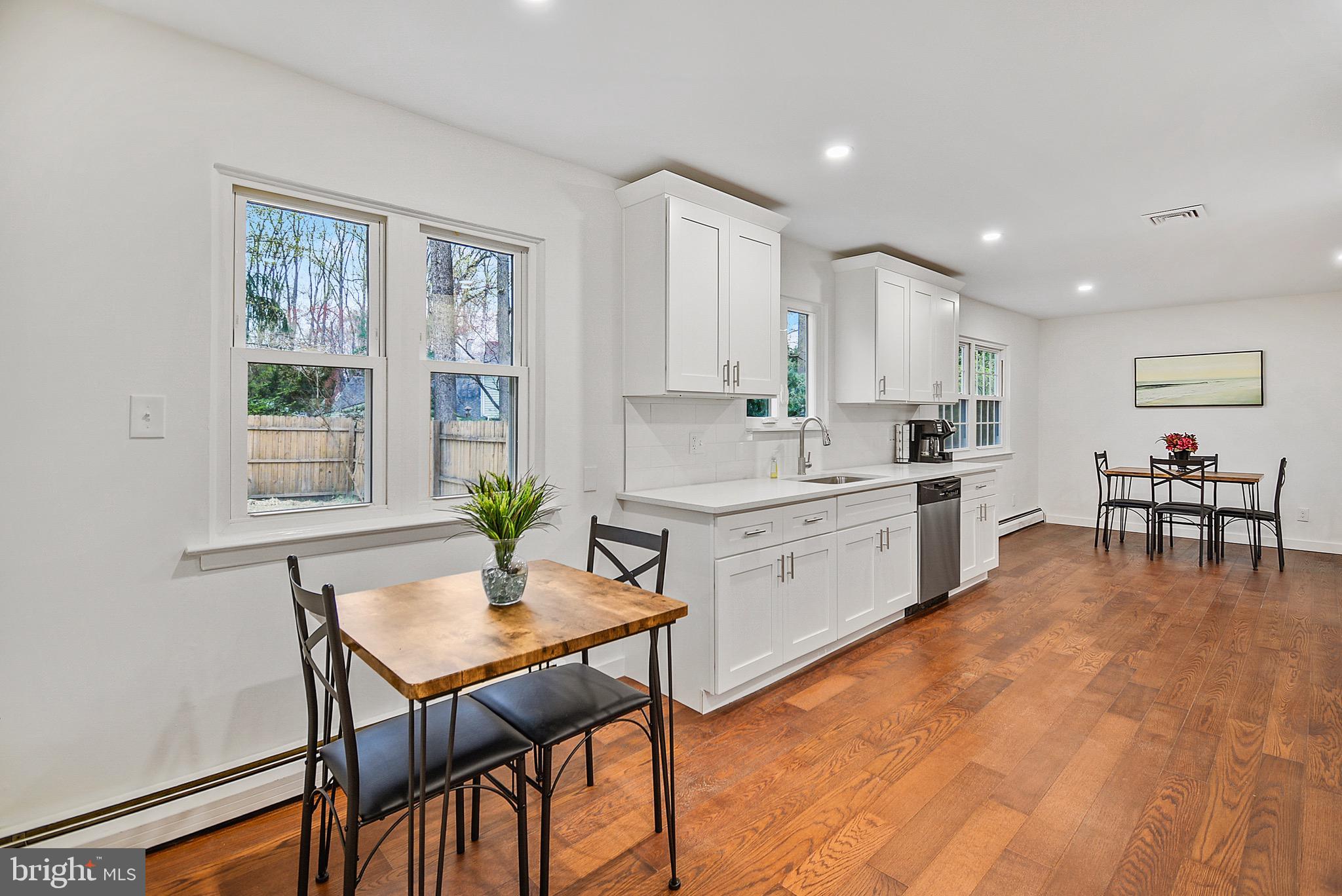 421 Concord Avenue Exton, PA 19341 - Photo 15 of 38 a kitchen with a table chairs stove and cabinets