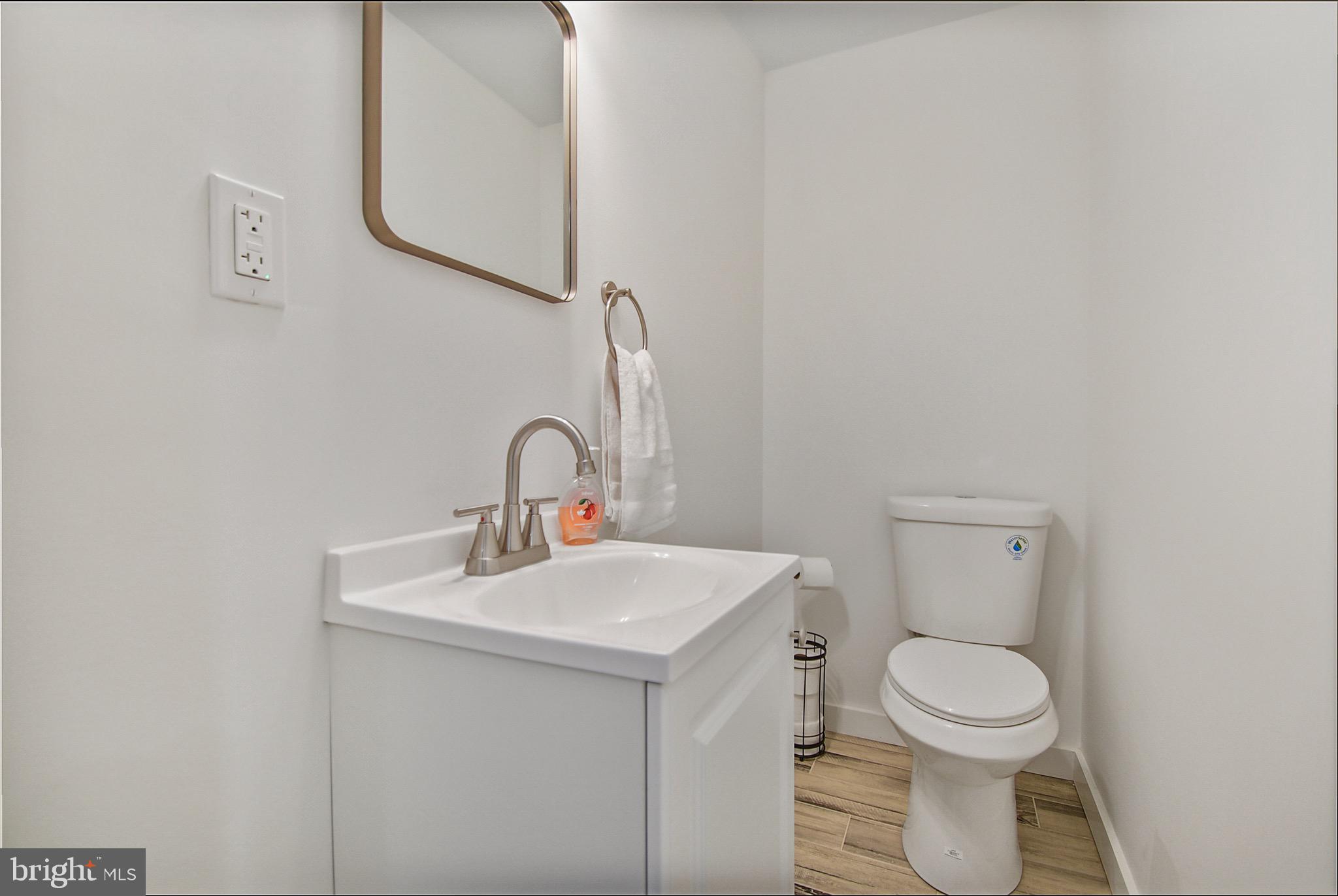 421 Concord Avenue Exton, PA 19341 - Photo 19 of 38 a bathroom with a toilet sink and mirror