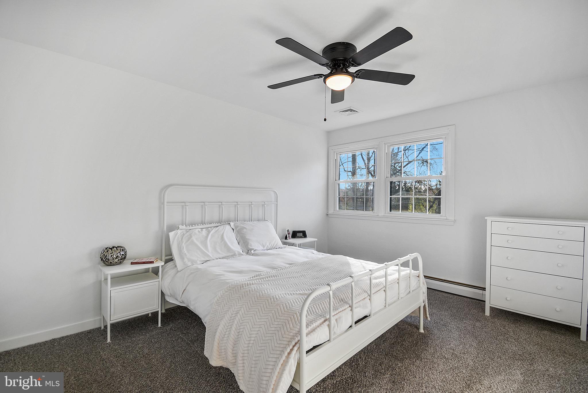 421 Concord Avenue Exton, PA 19341 - Photo 20 of 38 a bedroom with a bed and a chandelier