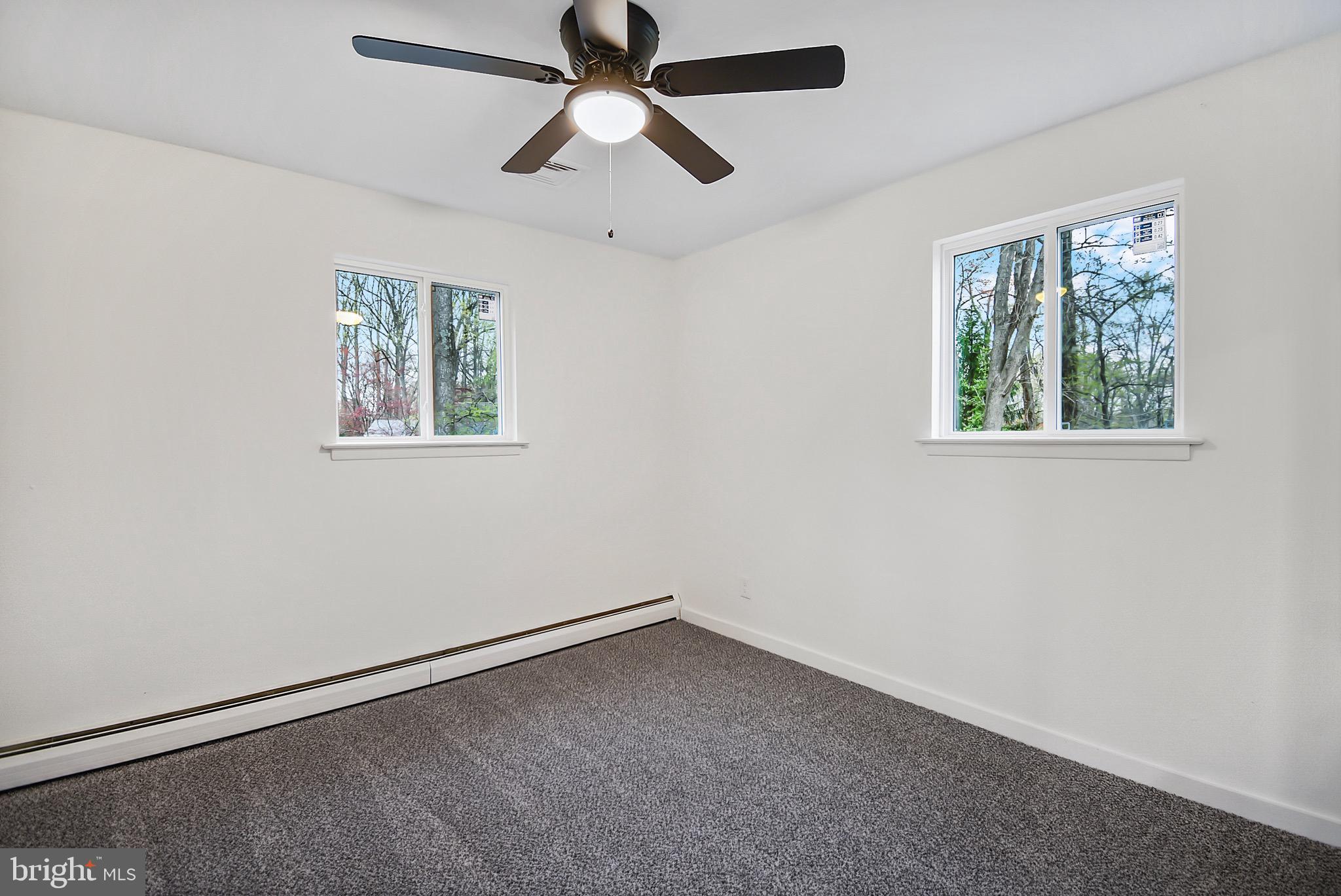 421 Concord Avenue Exton, PA 19341 - Photo 26 of 38 an empty room with a window and a fan