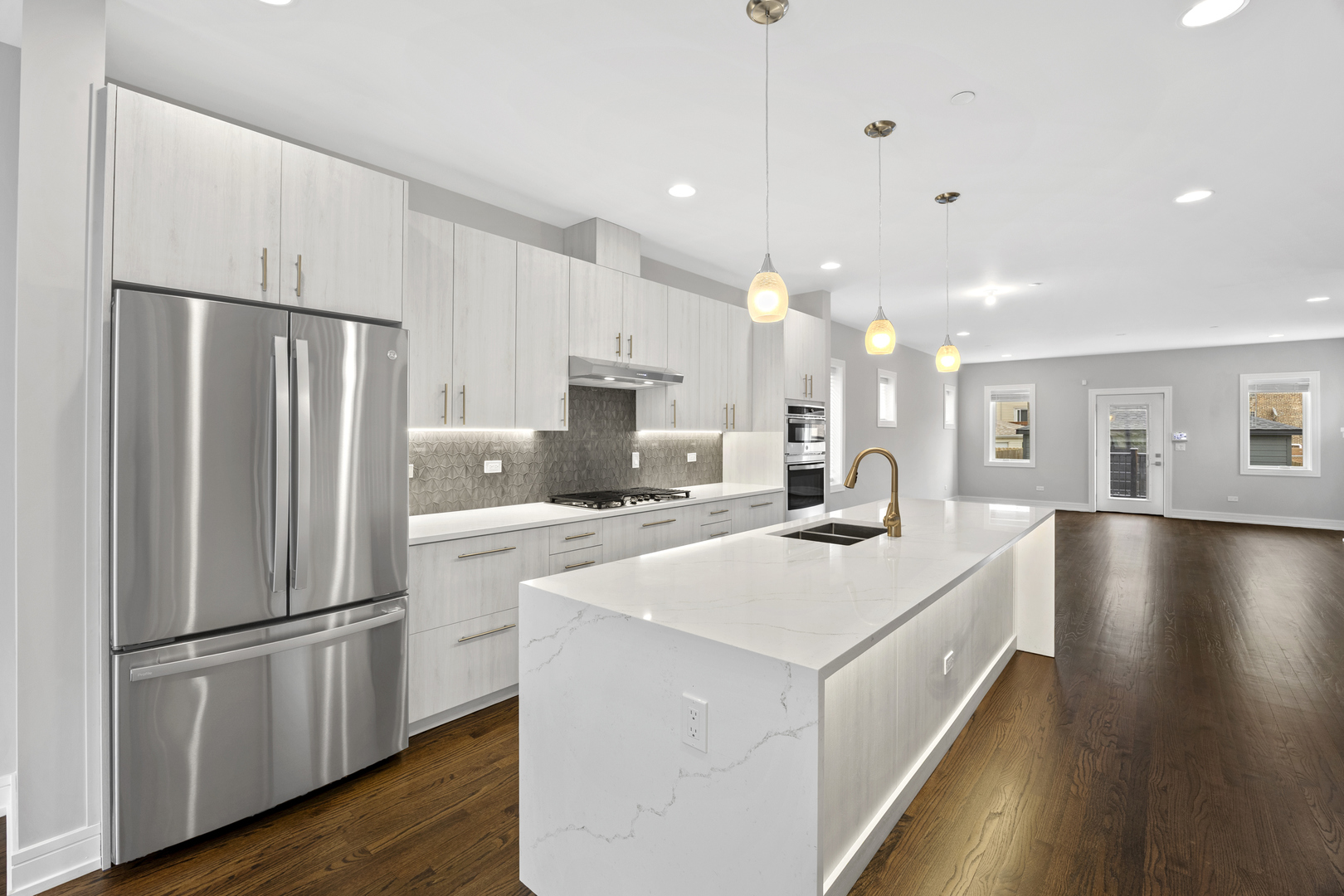 3231 South Shields Avenue Chicago, IL 60616 - Photo 12 of 58 a kitchen with kitchen island a white counter top space stainless steel appliances and cabinets