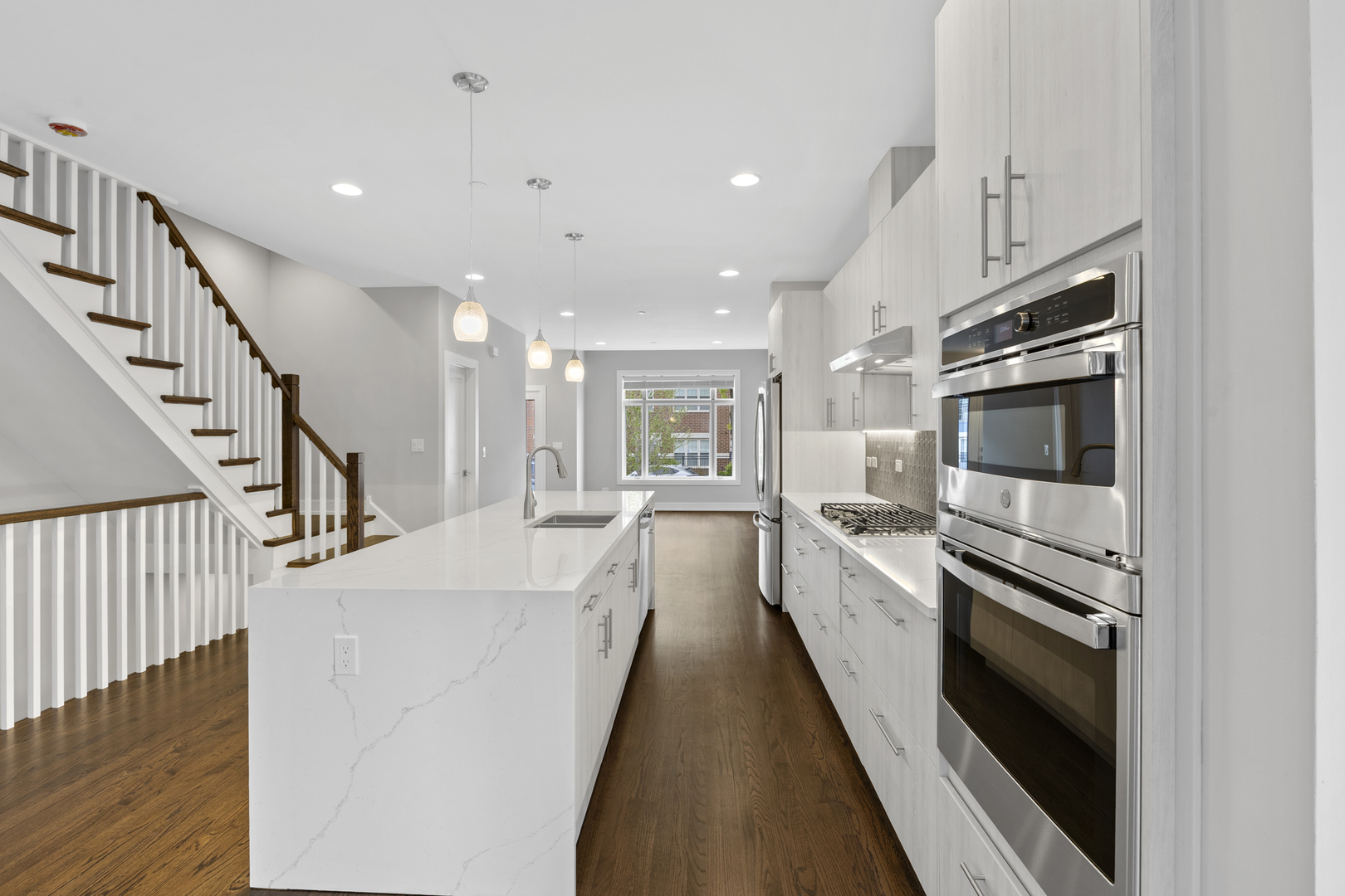 3231 South Shields Avenue Chicago, IL 60616 - Photo 14 of 58 a large white kitchen with stainless steel appliances