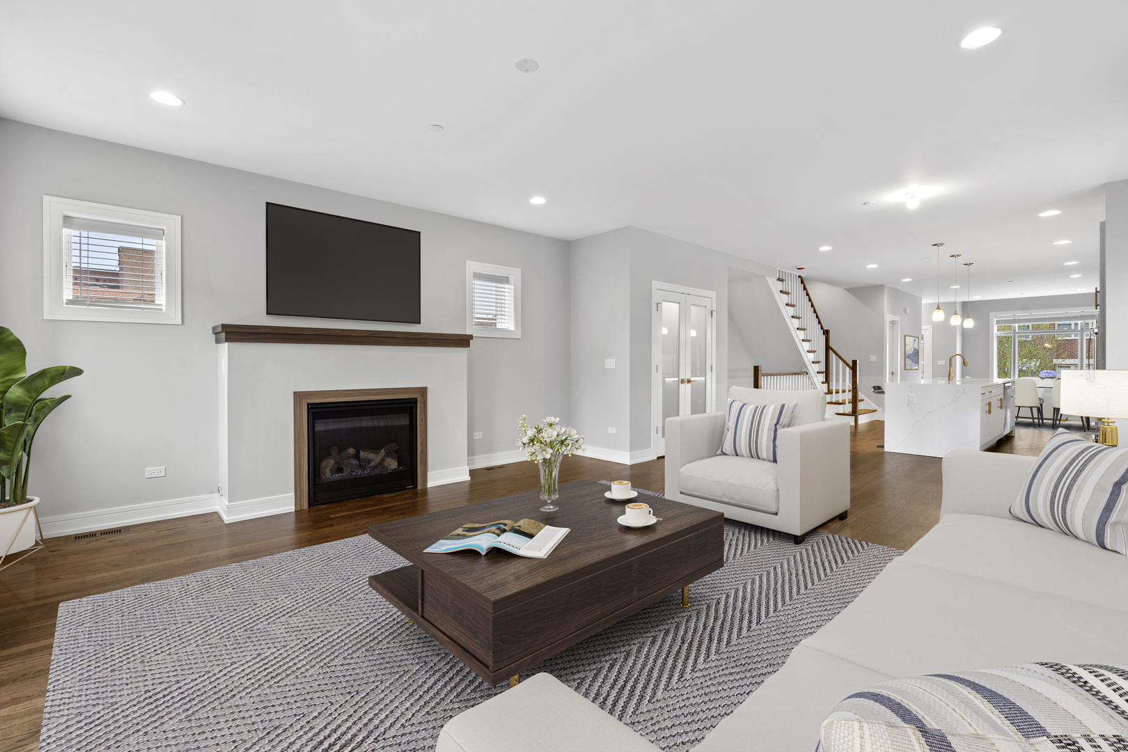 3231 South Shields Avenue Chicago, IL 60616 - Photo 15 of 58 a living room with furniture a fireplace and a flat screen tv