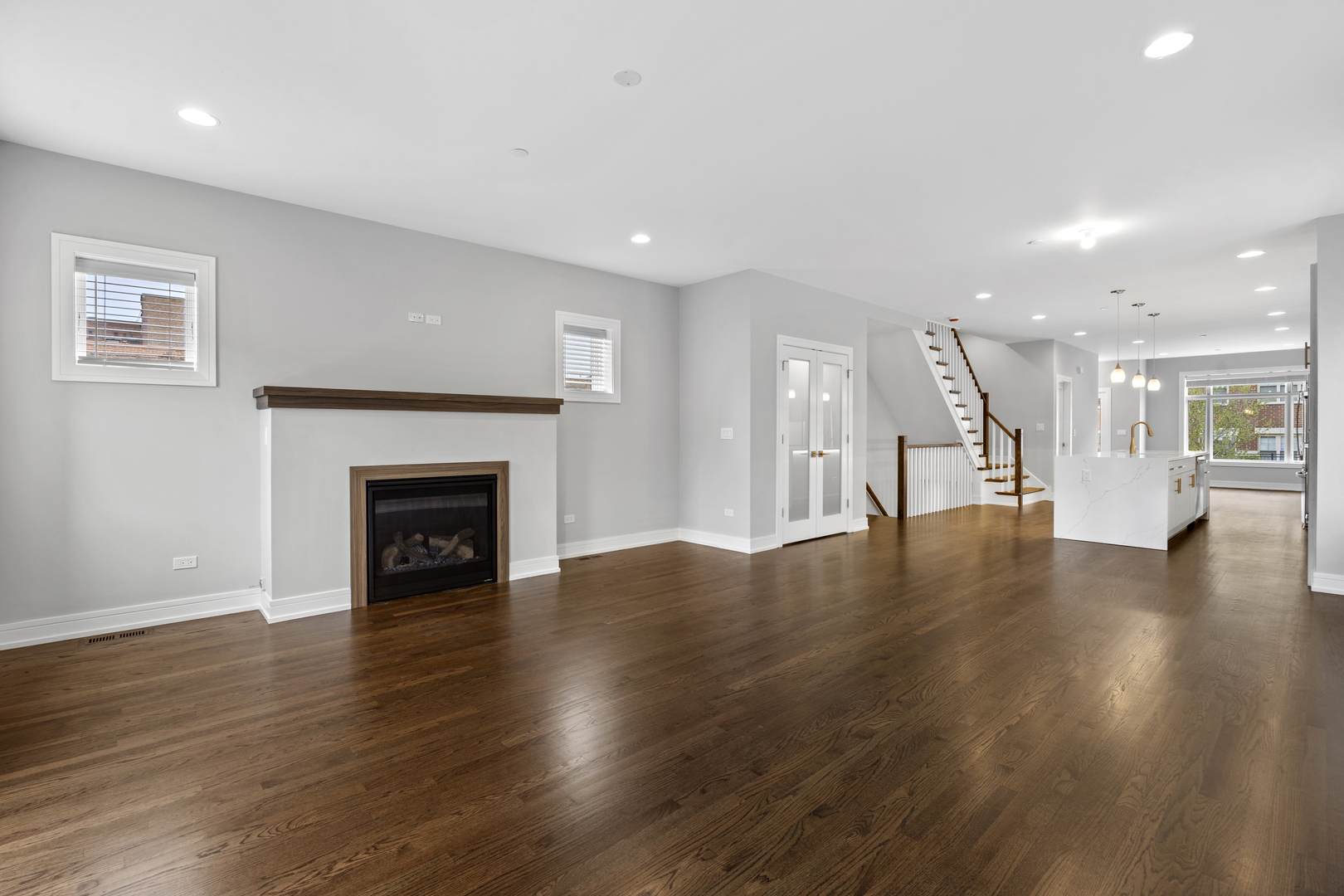 3231 South Shields Avenue Chicago, IL 60616 - Photo 16 of 58 a view of an empty room with wooden floor and a fireplace