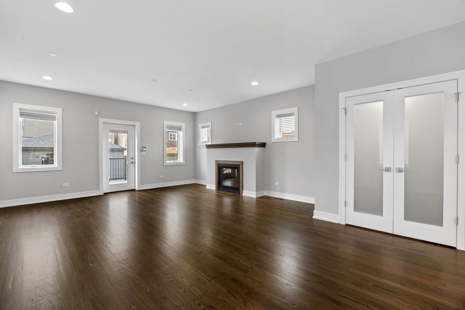 3231 South Shields Avenue Chicago, IL 60616 - Photo 19 of 58 a view of an empty room with wooden floor and a window