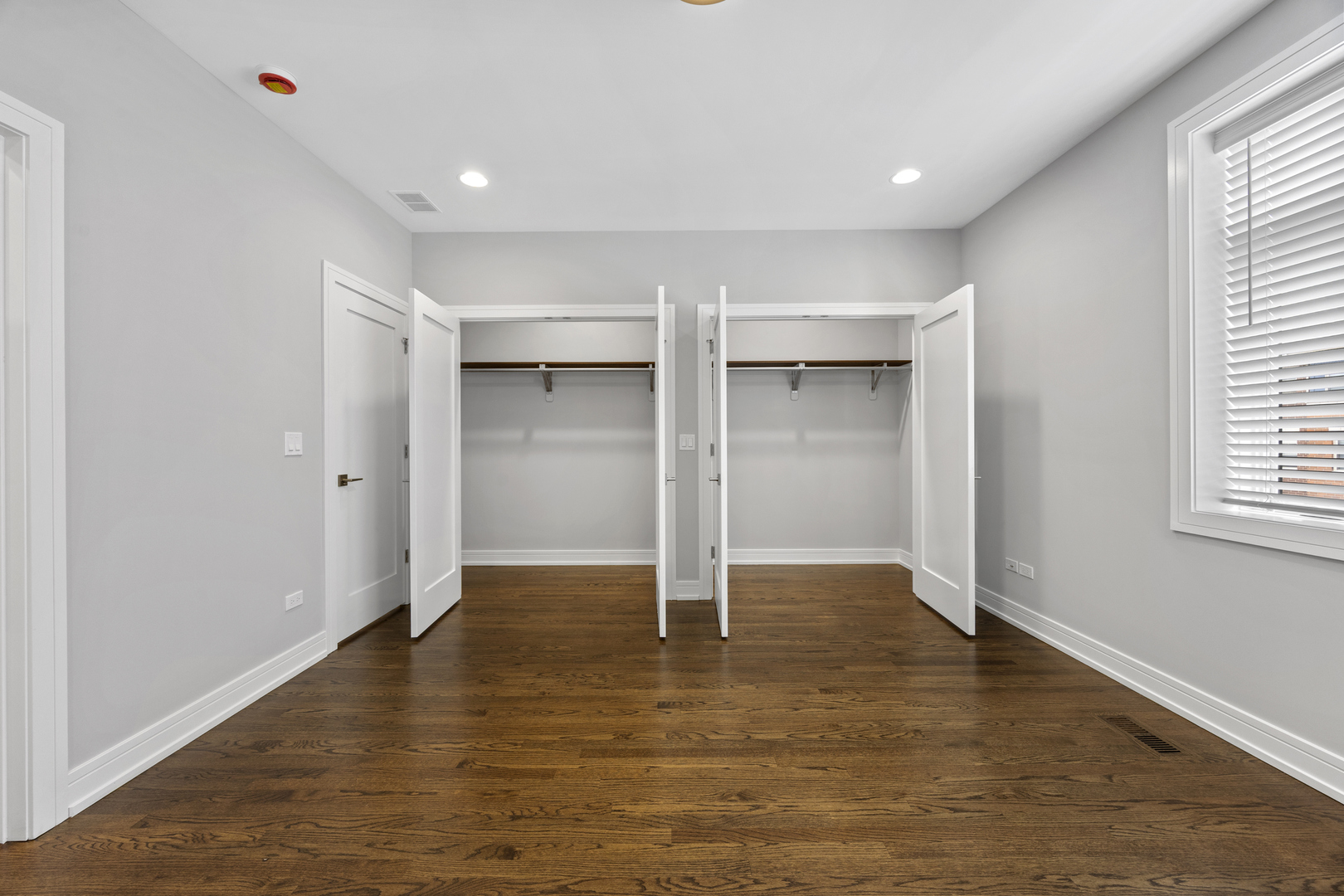 3231 South Shields Avenue Chicago, IL 60616 - Photo 26 of 58 an empty room with wooden floor closet and windows