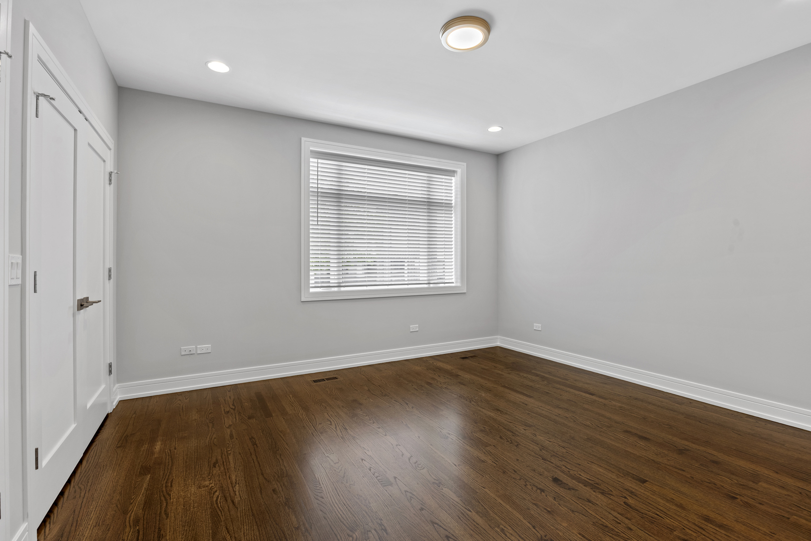 3231 South Shields Avenue Chicago, IL 60616 - Photo 36 of 58 a view of an empty room with wooden floor and a window