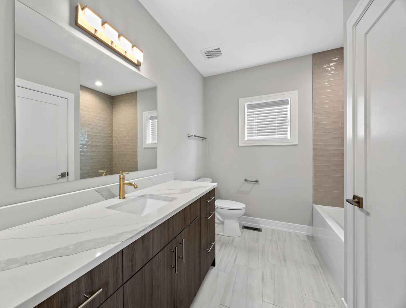 3231 South Shields Avenue Chicago, IL 60616 - Photo 38 of 58 a bathroom with a sink a toilet and a mirror