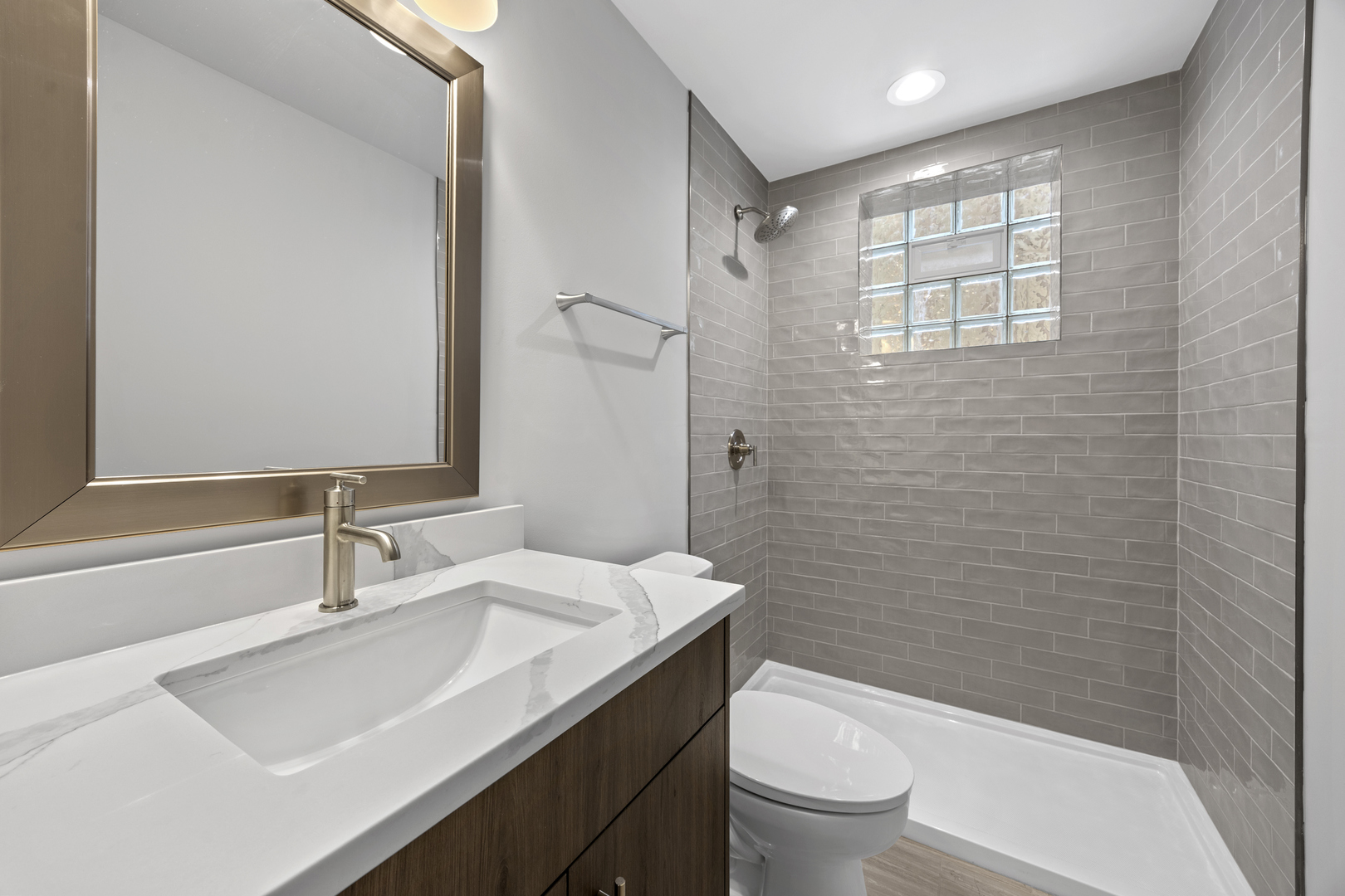 3231 South Shields Avenue Chicago, IL 60616 - Photo 46 of 58 a bathroom with a sink a toilet and shower