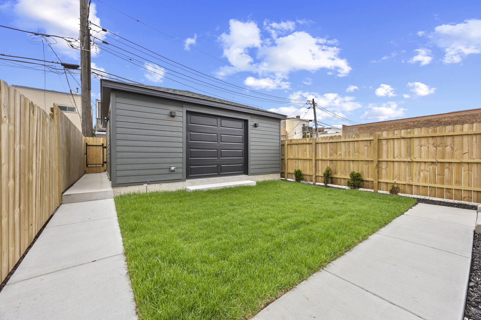 3231 South Shields Avenue Chicago, IL 60616 - Photo 57 of 58 a view of a backyard with wooden fence